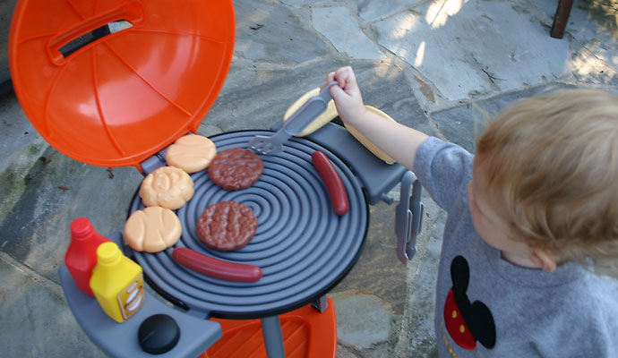 That Poore Baby Playing with the Little Tikes Sizzle n Serve Grill