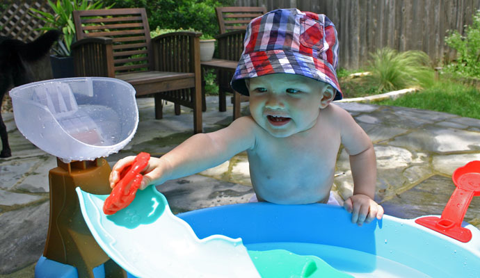 Playing with the crab. The set also includes a turtle, a frog and two fish.