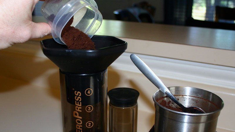 Add coffee grounds to the AeroPress